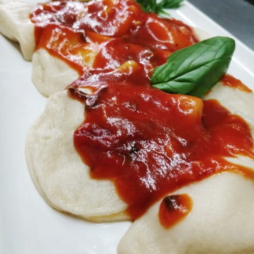 Ravioli stuffed with local sheep cheese and drizzled with tomato, garlic and basil sauce