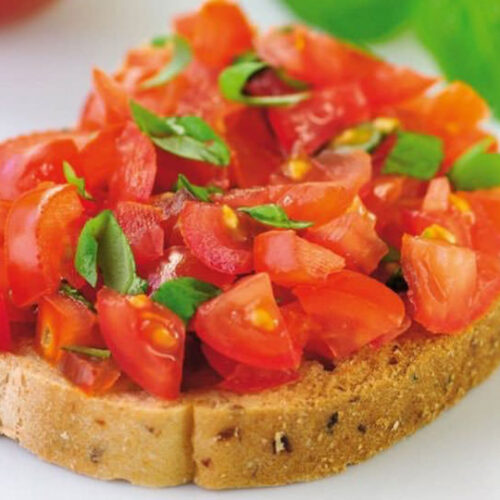 Toasted ciabatta topped with tomatoes, basil, garlic, onions, olives and capers.