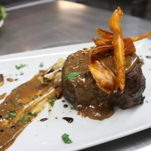 Char-grilled rib-eye served with our homemade pepper or mushroom sauce